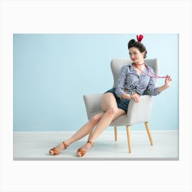 Pin Up Girl Sitting On Chair Canvas Print