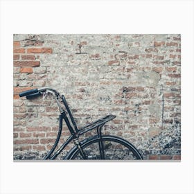 Old Bicycle Against Brick Wall Canvas Print