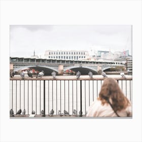 London, England I Scene of a woman contemplating pigeons on the banks of the Thames aesthetic moody with a geometrical
and peaceful grey urban London skyline panorama view with bokeh blur photography Canvas Print