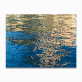 Golden reflections in the blue sea water Canvas Print