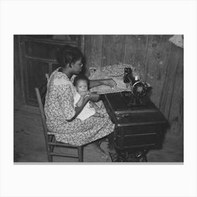 Wife Of Sharecropper, With Baby In Her Lap, At Sewing Machine, Family Will Work Under Tenant Purchase Program Canvas Print