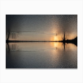 Reflection of golden sunlight in water at sunset Canvas Print