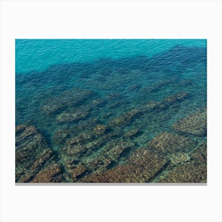 Turquoise sea and rocky coast Canvas Print