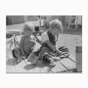 Children Of Spanish American Farm Family Playing On Wagon, Taos County, New Mexico By Russell Lee Canvas Print