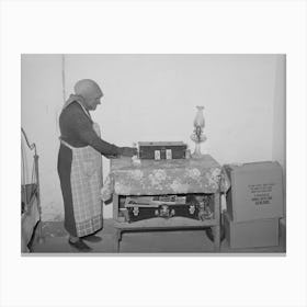 Woman Of Spanish Extraction Arranging Things On Table In Her Room, Concho, Arizona By Russell Lee Canvas Print