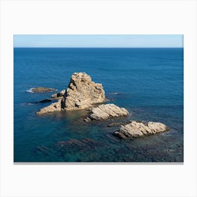 Rock formation in the blue Mediterranean Sea Canvas Print