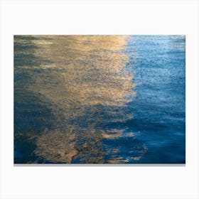 Abstract golden reflections in blue sea water Canvas Print
