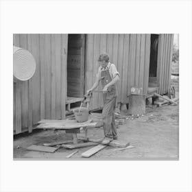 Son Of Sharecropper Pumping Water In Rear Of Cabin Home, New Madrid County, Missouri By Russell Lee Canvas Print