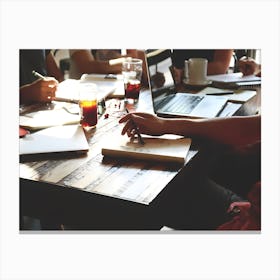 Group Of People At A Table Canvas Print