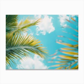 Palm Trees Against A Blue Sky Canvas Print