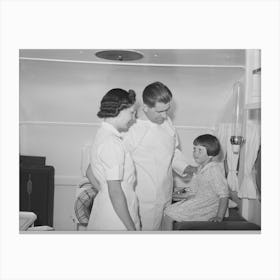 Doctor And Nurse With Little Girl In Trailer Clinic At The Fsa (Farm Security Administration) Migratory Labor Camp 1 Canvas Print