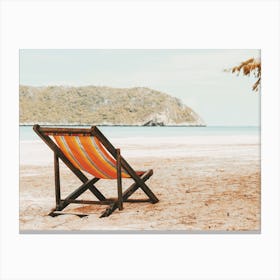 Beach Chair Near Ocean Canvas Print