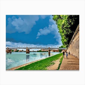 Garonne Riverside Walkway with Bridge in Toulouse. Toulouse, France. The image depicts a serene riverside walkway with a bridge in the background. The sky is partly cloudy, and the water reflects the blue hues of the sky. On the right side, there is a brick wall with greenery above it, and a few people are walking along the path. Canvas Print