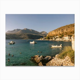 Boats and swimmers Greece Canvas Print