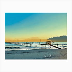 Pier at Sunset in Riviera. A long wooden pier extends out into the calm ocean waters, reaching towards a distant horizon. The sky is a vibrant blend of blue and orange, creating a picturesque sunset backdrop. The pier is constructed with wooden planks and metal railings, leading to a small platform at the end. The sandy beach stretches out in the foreground, with gentle waves lapping at the shore. Canvas Print