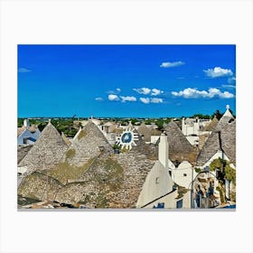 Trulli Houses in Italy. The image showcases a picturesque view of a traditional Italian village, featuring a cluster of Trulli houses with their distinctive conical roofs. The houses are constructed from white stone and have a rustic charm, with some roofs adorned with intricate patterns. The scene is bathed in warm sunlight, with a clear blue sky and fluffy white clouds overhead. Canvas Print