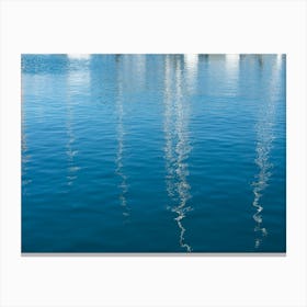 Reflections of sailboats in blue sea water Canvas Print