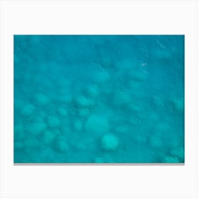 Rocks in the turquoise sea Canvas Print