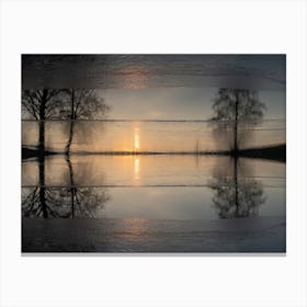 Reflection of trees in frozen water at sunset Canvas Print