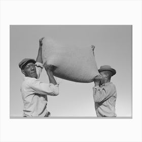 Workers Hefting A Bag Of Rice, Crowley, Louisiana By Russell Lee Canvas Print