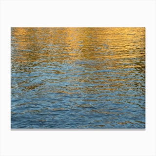Golden reflections in blue sea water Canvas Print