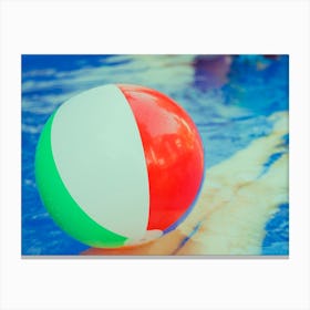 Colorful Beach Ball Floating In Pool Canvas Print