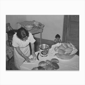 Brushing Lard On Freshly Baked Bread In Spanish American Farm Home Near Taos, New Mexico By Russell Lee Canvas Print
