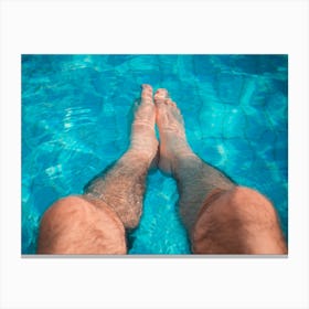 Young Man Relaxation At The Swimming Pool With His Legs In The Water Canvas Print