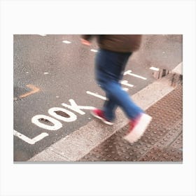 London, England I Pedestrian in motion on a crossing with Look Left inscription on the ground under the rain in the urban dynamic of a London street photography with a retro vintage autumn aesthetic Leinwandbild