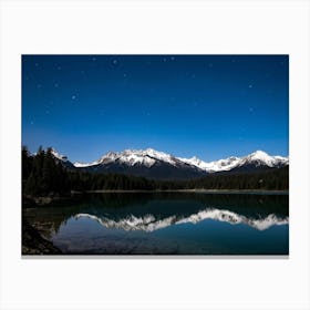 Snow Capped Mountains Towering In The Background Over A Tranquil Lake In The Foreground Their Majes Canvas Print