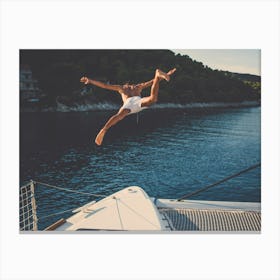 Man Jumping Off A Yacht Canvas Print