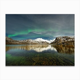 Northern lights over a mountain range Canvas Print