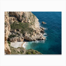 Rocky cove and blue water on the Mediterranean coast Canvas Print