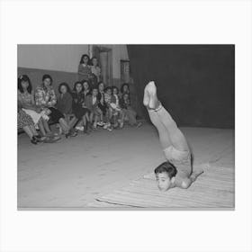 Spanish American Acrobat Of Traveling Show, Audience In Background, Penasco, New Mexico By Russell Lee Canvas Print