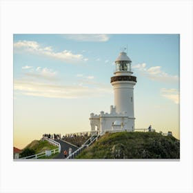 White Lighthouse At Dusk On Cliff With Beautiful Skies and Clouds Canvas Print