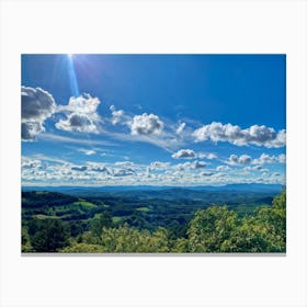 Cumulus Clouds Strewn Across A Blue Sky Above A Sweeping Scenic Landscape Vibrant Greenery Rollin (1) Canvas Print