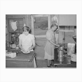 Mother And Daughter Working In The Kitchen Of The Cafe At Pie Town, New Mexico, The Daughter With Her Husban Canvas Print