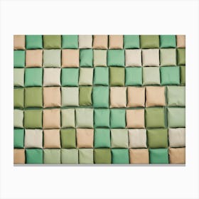 A Wall Of Square Pillows In Various Shades Of Green And Beige Canvas Print