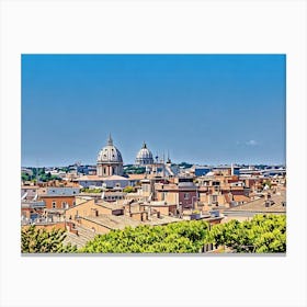 Rooftops and Domes in Rome. This image depicts a picturesque view of a historic cityscape, characterized by its terracotta rooftops and prominent domed structures. The two large domes, likely belonging to significant religious or historical buildings, stand out against a clear blue sky. The foreground is filled with a variety of buildings, showcasing a mix of architectural styles and colors, while lush green trees add a touch of nature to the urban scene. Canvas Print