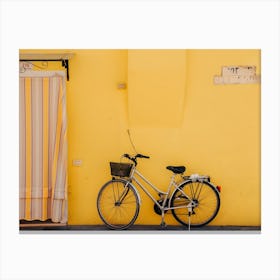 Yellow Wall With A Bike Canvas Print