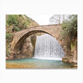 Arch Bridge Over Waterfall Canvas Print