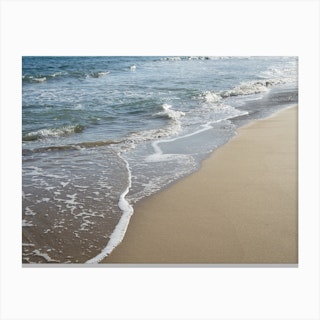 Sea water, waves and sandy beach Canvas Print