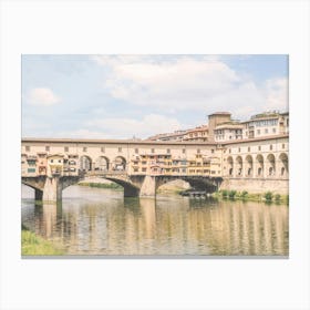 Florence, Italy I Pastel Ponte Vecchio on the Arno to experience dolce vita in Tuscany in sunny to retro vintage atmosphere photography with an Italian summer yellow sunny aesthetic like an old Mediterranean village Canvas Print