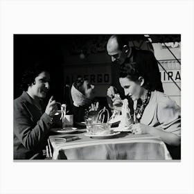 Women Tuck Into Plates Of Spaghetti At A Restaurant On The Italian Riviera Canvas Print