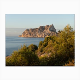 Mediterranean Sea, pine trees and Peñón de Ifach at sunrise Canvas Print