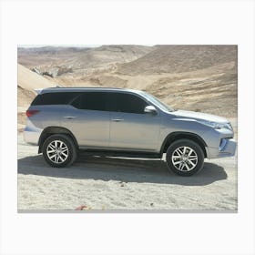 Car in the desert Canvas Print