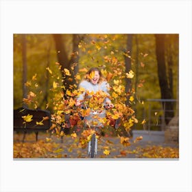 Autumn Girl Riding A Bike Canvas Print