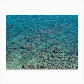 Aerial view of a bay with blue sea water Canvas Print