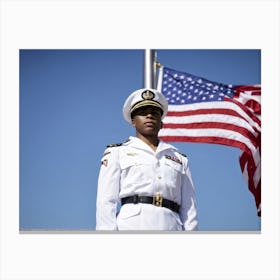 A Reverent Soldier Dressed In An Immaculate Uniform To Honor Memorial Day Stands I Front Of A Flut 2 Canvas Print