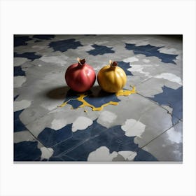 A Red And A Yellow Pomegranate Sit On A Patterned Tile Floor With A Puddle Of Spilled Yellow Paint Canvas Print